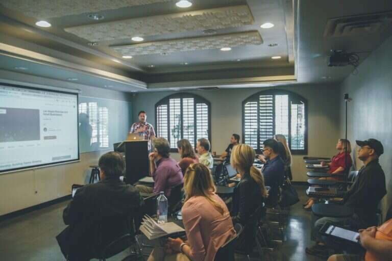 Sales team in a training session watching a presentation