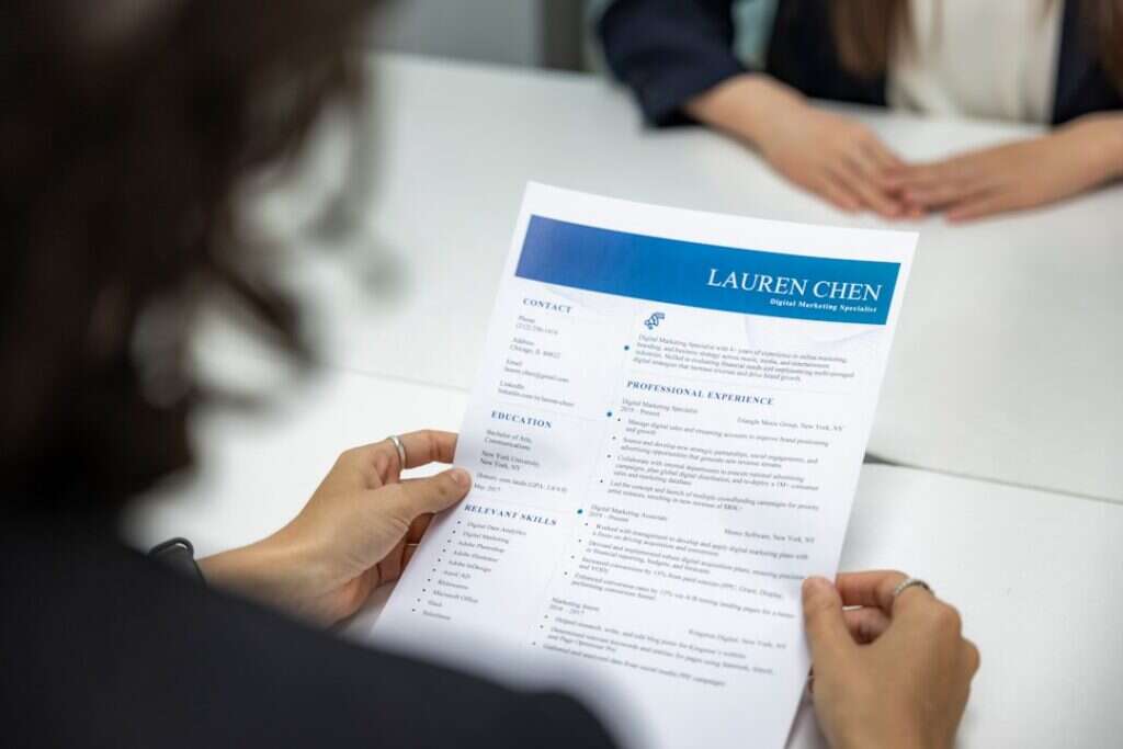 Recruiter reading a candidate's CV during an interview