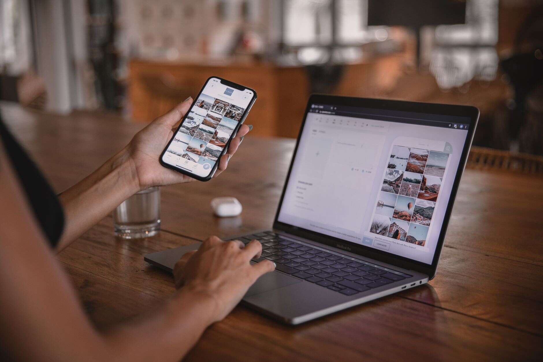 Social media manager reviewing scheduled posts on a phone and laptop