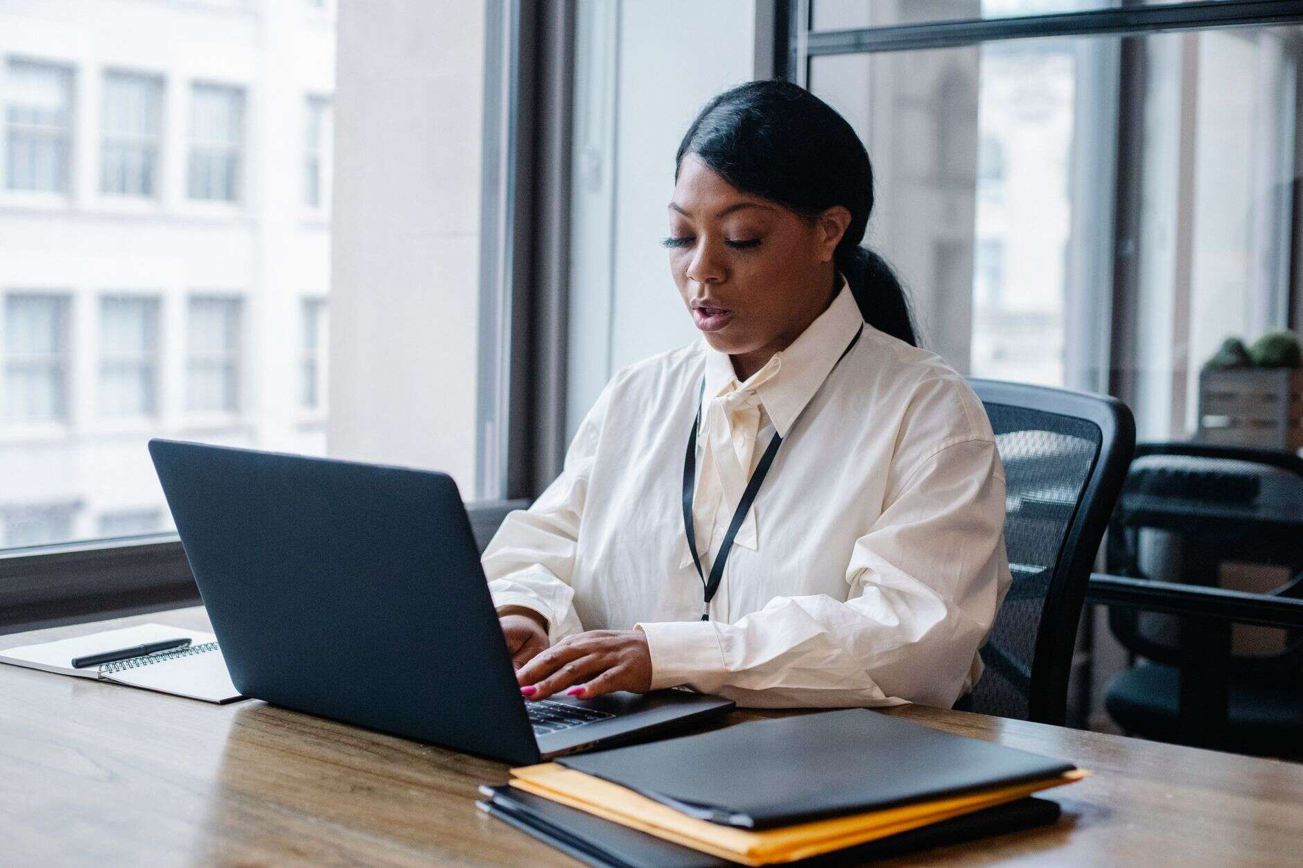 Operations manager working on a laptop at her desk
