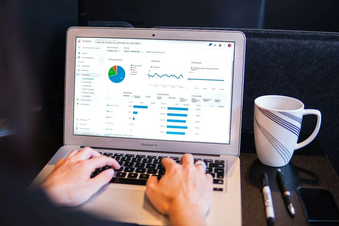 Marketing analyst reviewing a web analytics dashboard on a laptop